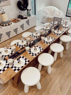 the table is set with black and white checkered plates