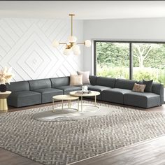 a modern living room with gray couches and white walls