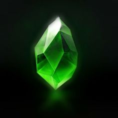 a green diamond on a black background with the light reflecting off it's side