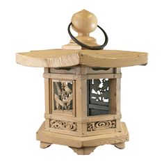 an old fashioned wooden lantern with carvings on the front and sides, is shown against a white background