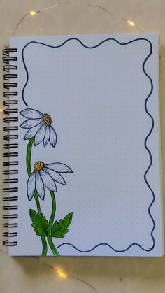 a notebook with some flowers on it