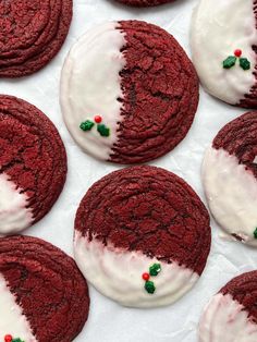 red velvet cookies with white frosting and holly decorations