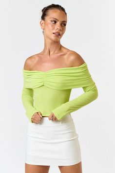 Long Sleeves Solid Ribbed Knit Off the Shoulder Ruched Detail 75% Polyester + 20% Rayon + 5% Spandex Model is wearing a size Small. Height 5'8" Bust 32A" Waist 24" Hips 34" Spring Stretch Ribbed Knit Top, Spring Ribbed Stretch Tops, Stretch Ruched Tops For Fall, Spring Ribbed Elastane Tops, High Stretch Knit Top For Spring, High Stretch Spring Knit Top, Fitted Green Ruched Tops, Spring Ruched High-stretch Tops, Ribbed Knit Top For Spring