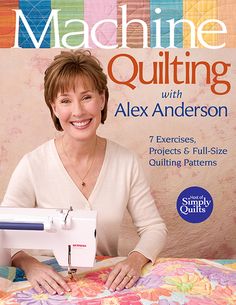 a woman sitting in front of a sewing machine on top of a quilter's table