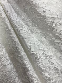 A beautiful, white, floral brocade fabric. It is great for apparel, drapery, and much more. High quality. Sold by the yard. (1 yard= 36 in.) Width is 60 in. All orders will be cut in one continuous piece. Free shipping in US. For any large or wholesale orders, message us. Thank you for your time and business! White Brocade Fabric, White Damask, Wedding Heels, Brocade Fabric, Wedding Board, Material Design, White Fabric, White Design, Textile Fabrics