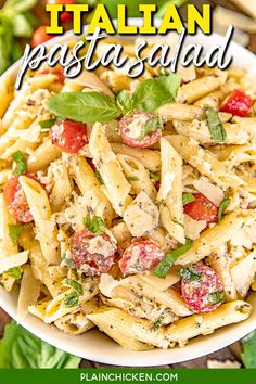 this pasta salad is loaded with chicken, tomatoes and spinach it's ready to be eaten