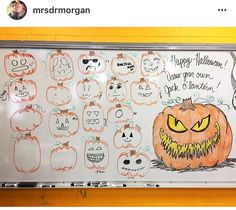 a white board with lots of pumpkins drawn on it's sides and faces