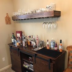 a bar with liquor bottles and glasses on it