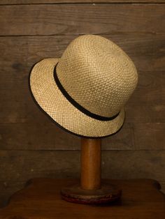 "An authentic antique woven cloche from the late 1920s or 30s era. Originally acquired by a European hat shop that closed in the 1930s. Made from a light colored woven straw with a simple yet elegant black wax coated ribbon and buckle. Only minor signs of age from storage, never been previously used. Centimeter measurements written on the inside of the crown by the hat maker. material : straw, silk? ribbon color : black, light beige condition : little to no wear, has never been used size : pleas Adjustable Cloche Hat In Flapper Style, Adjustable Cloche Flapper Hat, Adjustable Wide Brim Flapper Hat, Gatsby Style Wide Brim Adjustable Hats, Classic Adjustable Cloche Hat, Gatsby Style Adjustable Cloche Hat With Curved Brim, Kentucky Derby Flapper Hat With Short Brim, Adjustable Classic Cloche Hat, Adjustable Gatsby Cloche Hat With Curved Brim