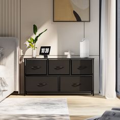 a bedroom scene with focus on the dresser and bed side table in the foreground