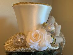 a white hat with flowers and ornaments on it