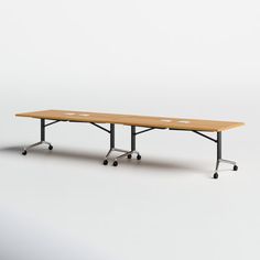 a long table with wheels on the bottom and one leg up, sitting in front of a white background