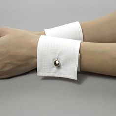 Decorative detachable shirt cuffs will help you to complete your unique look. It is possible to wear them with a jacket, uniform, dress, or sweater. Or you could wear them with a T-shirt. Be special, and create your own unique style! Please find out the length of your wrist to choose the right size. You may order exactly your size or a larger one if you want the cuff not to be tight. Before ordering, watch my video on the channel on how to measure your wrist. This is necessary so that you choose the correct cuff size. These sizes are only suitable for my store https://www.youtube.com/watch?v=ez5bpwRrkLA Cuffs is produced from 100% cotton. Sizes: Width: 7 cm / 2.8 inches The size is based on your wrist circumference. The size is the length of the cuffs band. Please measure your wrist. Pleas Shirt Cuff Pattern, Elegant Formal Cuff Bracelet, Formal White Cuff Bracelet, White Formal Cuff Bracelet, Adjustable Open Cuff Bracelet For Formal Occasions, Elegant White Cuff Bracelet, Classic Open Cuff Bracelet For Formal Occasions, Adjustable Cuff Bracelet For Formal Occasions, Cuffs On Sleeves