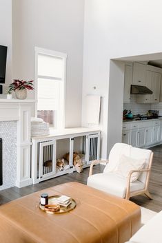 a living room filled with furniture and a flat screen tv mounted on the wall above a fireplace