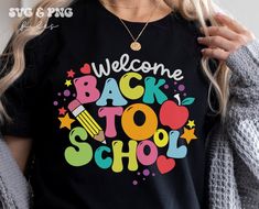 a woman wearing a black back to school shirt with the words welcome back to school on it