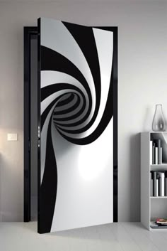 an open door with black and white swirls on it