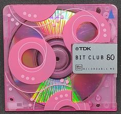 the cd case is pink and has several discs in it, including one that says btt club 80