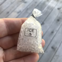 an ice bag with the number 8 on it is held in someone's hand