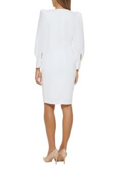 This wondrous white dress from Calvin Klein features long puff sleeves and a deep v-neck and is versatile enough to move between the workplace to drinks. | Calvin Klein Women's Long Sleeve V-Neck Puff Sleeve Solid Sheath Dress, 10 Calvin Klein White Dress, White Dress Outfit, Calvin Klein White, Long Puff Sleeves, Calvin Klein Woman, Rehearsal Dinner, Deep V Neck, Puff Sleeves, Sheath Dress