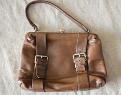 "Vintage antique chestnut color Leather purse - medium size bag. Dark brown Leather Handbag, evening bag with golden tone closure and frame. The frontal straps is decorative only with various sizes. The bag has 1 open way inside compartment, 2 loose compartments and one inside zippered pocket, too. condition: visually great bag.In the lining inside are some dark spots. measurements: height without handles 19 cm / 7.5\" in width 24,5 cm / 9.6\" in" Vintage Cognac Shoulder Bag For Formal Occasions, Vintage Formal Shoulder Bag With Brass Hardware, Vintage Bags With Gold-tone Hardware, Vintage Evening Bags With Brass Hardware, Vintage Shoulder Bag With Brass Hardware For Evening, Vintage Brown Bag With Gold-tone Hardware, Vintage Brown Shoulder Bag For Formal Occasions, Evening Brown Satchel With Hasp Closure, Vintage Brown Rectangular Shoulder Bag