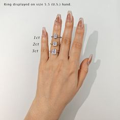 a woman's hand with three rings on it