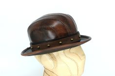 Fitted Leather Fedora Hat Bands, Fitted Leather Hat With Short Brim, Fitted Leather Fedora Hat, Fitted Leather Hat With Curved Brim, Handmade Leather Hat With Flat Brim, Brown Leather Top Hat With Short Brim, Fitted Leather Top Hat With Short Brim, Fitted Leather Top Hat With Flat Brim, Fitted Brown Leather Fedora