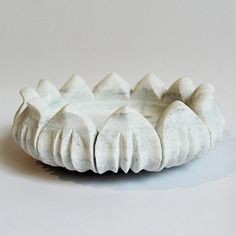 a white ceramic bowl sitting on top of a table