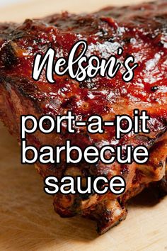 a piece of barbecue sauce sitting on top of a wooden cutting board with the words, nelson's port - a - pit barbecue sauce