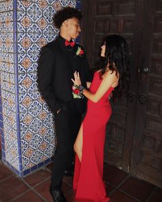 Red Prom Guy Outfit, Prom Tuxedo Ideas 2024, Red Tuxedo For Men Prom, Red Prom With Date, Red Prom Theme Couple, Black And Red Chambelan Outfits, Red Dress Black Suit Couple, Red Prom Outfits For Guys, Black And Red Hoco Couple