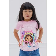 Celebrate your special day with Gabby and her friends in this stylish Gabby's Dollhouse birthday shirt! This cute short sleeve tee features a fun rainbow design, the words "Have An A-Meow-Zing Birthday," and colorful artwork of Gabby, MerCat, Kitty Fairy, and Cakey Cat holding birthday balloons. Dressed in this soft and comfy Gabby's Dollhouse tshirt, your little girl is ready for an exciting birthday adventure! Pink Short Sleeve T-shirt For Playtime, Multicolor Short Sleeve T-shirt With Hello Kitty Print, Pink Fun T-shirt For Playtime, Cute Rainbow Short Sleeve Tops, Cute Short Sleeve T-shirt For Playtime, Rainbow Short Sleeve Top For Birthday, Rainbow Short Sleeve Top For Birthdays, Gabby's Dollhouse Birthday, Birthday Toddler Girl