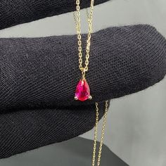 Solid Gold Ruby Pear Shape Pendant Necklace Product Features Weight: 1.30 Gr ⚖️ Material Colors: Yellow Gold, Rose Gold, and White Gold 🌈 Chain Length: 17 inch, 18 inch, 19 inch, 20 inch Stone Type: Ruby Shape: Pear 🌼 Presentation: Shipped with a special box and bag 🎁 Returns: Right to return within 7 days 🔄 Material and Color: Product color does not fade or darken ✨ Handcraftsmanship and Uniqueness: Handcrafted and may vary by 5% (+-) 🛠️ Ruby Information Ruby is a precious gemstone known a Pink Pear-shaped Gemstone Necklace, Fine Jewelry Ruby Drop Necklaces, Fine Jewelry Ruby Drop Necklace, Red Pear-shaped Necklace For Gift, Fine Jewelry Ruby Necklace In Pear Shape, Yellow Gold Ruby Teardrop Necklace, Ruby Teardrop Pendant Necklace, Yellow Gold Teardrop Ruby Necklace, Teardrop Ruby Necklace In Yellow Gold