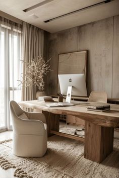 an office with a desk, chair and computer on the table in front of a window