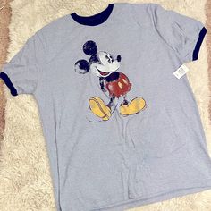 New! With Tags! Disney Parks Mickey Mouse T-Shirt. Light Blue With Navy Blue Collar And Sleeves. Men’s Size Large! Blue Short Sleeve Tops With Mickey Mouse, Blue Mickey Mouse Short Sleeve Tops, Blue Crew Neck Tops With Mickey Mouse Design, Blue Cotton Mickey Mouse T-shirt, Blue Mickey Mouse Cotton T-shirt, Blue Mickey Mouse Crew Neck T-shirt, Blue Mickey Mouse T-shirt For Disney Events, Blue Mickey Mouse T-shirt, Blue Mickey Mouse Fun T-shirt