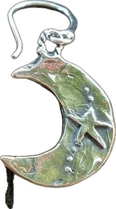 a metal hook with a crescent and star on it