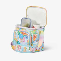 Color and chill each day in a rainbow way with this very special Care Bears cooler! Bright, happy and as cute as can be, this colorfully pastel Care Bears lunch bag features everyone’s favorite lovable Bears around their clouds in Care-A-Lot and playful details — like rainbow ombré zippers and straps! Trendy Multicolor Lunch Bag For Travel, Casual Multicolor Lunch Bag For Travel, Playful White Lunch Bag For Everyday Use, Fun Multicolor Lunch Box For Travel, Cute Multicolor Lunch Box For Everyday Use, Multicolor Fun Lunch Box For Travel, Cute Multicolor Lunch Bag For Travel, Trendy Multicolor Lunch Bag, Care Bear Merch