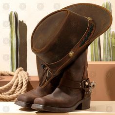 Elevate your western style with this handcrafted leather cowboy hat, designed for both cowboys and cowgirls. Whether you're out on the ranch or enjoying a night under the stars, this hat adds a touch of authenticity to any outfit. Made from genuine leather, it's not just a hat--it's a statement piece that combines rugged durability with timeless style. Available in four distinct colors--black, brown, mustard, and burgundy--this hat ensures you find the perfect shade to match your personality. Wi Cowgirl Hat Design, Vintage Leather Hat For Western-themed Events, Western Leather Hat In Distressed Brown, Distressed Brown Leather Hat For Rodeo, Western Distressed Brown Leather Hats, Country Style Distressed Brown Leather Hat Bands, Rustic Leather Hat For Western-themed Events, Vintage Leather Hat Band For Rodeo, Western Distressed Brown Hat For Outdoor