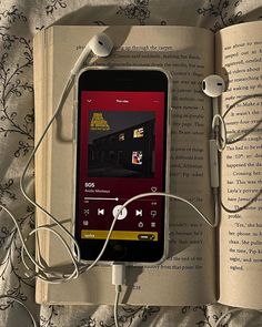 an open book with headphones attached to it