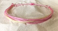 Super cute Pura Vida style waxed string stackable bracelets. Lots of colors available (see photos). Please see photos for bracelet examples and note your color number(s) in the Personalization box. Feel free to send me a message &/or picture if you would like to design your own! 😊 Thank you!! ❤️ 🌴 🌞 🌺 🌊 ️ 🏝 ⛱ 👙 🐠 Adjustable Pink Stackable Friendship Bracelets, Adjustable Stackable Pink Friendship Bracelets, Casual Pink Stackable Friendship Bracelets, Casual Pink Stackable Jewelry, Hypoallergenic Pink Friendship Bracelets For Beach, Adjustable Cute Bangle Friendship Bracelets, Cute Adjustable Bangle Friendship Bracelets, Basic Bracelet, Surfer Bracelets