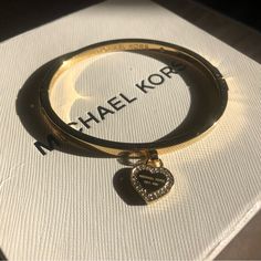 Featuring A Logo Heart Id Tag With A Pave Crystal Halo, This Gold-Tone Hinged Bracelet By Michael Kors Is Simple But Striking. Brand New Without Tags, Excellent Condition. Woman Hygiene, Sparkling Accessories, Adidas Gucci, Michael Kors Bracelet, Logo Heart, Vintage Thrift, Winter Festival, Michael Kors Jewelry, Jewelry Accessories Ideas