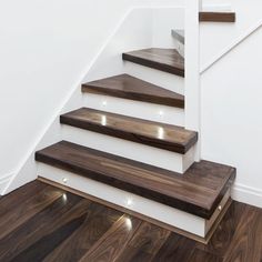 the stairs are made of wood and have led lights on each step to light them up