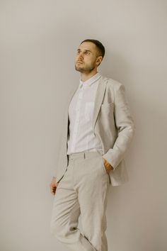 Our simple wedding suit consists of three components which are handcrafted from 100% finest softened Baltic linen: linen jacket, linen pants, linen shirt. Linen jacket comes in a slim/regular fit. It features three pockets, two-button closure, long sleeves. The jacket has a versatile classic style. It can be used for various occasions or casual wear.  Handcrafted with a double linen layer.  Linen shirt - a true embodiment of minimalism and timeless elegance. It designed with a comfortable slim/r Beige Linen Suit For Wedding, Linen Wedding Suit With Suit Collar, Beige Linen Wedding Suit, White Linen Semi-formal Suits, Wedding Linen Set With Notch Lapel, Wedding Linen Sets With Notch Lapel, Tailored Linen Suit For Wedding, White Linen Wedding Blazer, Simple Wedding Suit