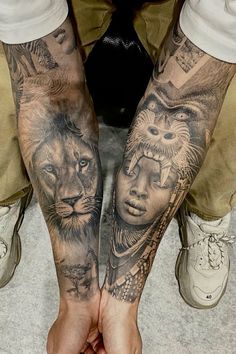 two people with tattoos on their arms and feet, one holding the other's hand