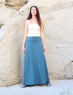 Shape – The Georgia has 2 flowy pieces of fabric in front and back with slits on the side that allow under pants to peek through, creating a layered silhouette attached at waistband. The pants have a straight-cut for a relaxed yet tailored fit. Size – Order based on your HIP measurement Fabric Shown – Light Hemp/Organic Cotton Knit Color Shown – Seafoam Chic Cotton Bottoms For Layering, Casual Stretch Maxi Skirt With Side Slits, Versatile Long Skirt With Relaxed Fit, Casual Flowy Skirt With Side Slits, Fitted Cotton Bottoms For Layering, Versatile Solid Color Bottoms For Layering, Rayon Long Skirt, Flowy Full-length Rayon Skirt, Full Length Flowy Rayon Skirt