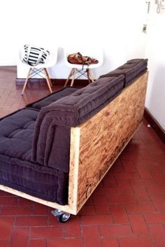 a couch sitting on top of a wooden frame