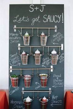 a chalk board with some buckets on it