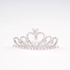 This is a high quality Mouse Ear Rhinestone Mini Tiara. This is made from silver plated alloy. The metal comb is attached and easy to use. Here is a link to our Business Insider video showcasing some of our Princess Tiaras: https://youtu.be/GNTaVqAsDkw The crown measures 3.5 inches wide and 2 inches tall. Attach to your bun...and show your princess side! 👑👸 Silver Rhinestone Headband, Mini Tiara, Princess Tiaras, Purple Pixie, Tiara Hair, Rose Gold Tiara, Disney Weddings, Mini Crown, Disney Fairy Tale Weddings