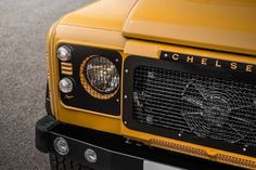 the front grille of a yellow vehicle