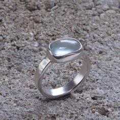 * Material: Sterling silver *Stone: Aquamarine 10x12mm * Available in sterling silver, size 53 FR * This item is handmade, please allow 4-6 days for shipping. Need help figuring out your ring size? Please contact me To go back to my shop: https://www.etsy.com/fr/shop/AtelierTiuh Modern Blue Rings With Large Stone, Modern Silver Hallmarked Topaz Ring, Modern Hallmarked Silver Topaz Ring, Silver Blue Topaz Ring With Polished Finish, Modern Blue Moonstone Gemstone Ring, Modern Blue Moonstone Ring, Sapphire Silver Ring, Solitaire Rings, Aquamarine Rings