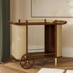 a wooden cart sitting on top of a hard wood floor