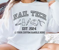 Our custom nail tech name sweatshirt is the perfect gift for any nail artist. Crafted from premium, ultra-soft cotton, this sweatshirt offers comfort and durability, making it ideal for those chilly days. The design features your business name/insta handle prominently displayed on the front, ensuring that your brand stands out in any crowd. With a variety of sizes and colors available, you can tailor the sweatshirt to match your business's branding or your personal style. Whether you're looking to promote your brand at a networking event, create a uniform look for your team, or simply want to showcase your business pride, our Sweatshirt is a versatile and fashionable choice. Ideal for any situation, a unisex heavy blend crewneck sweatshirt is pure comfort. These garments are made from poly Artist Shirts, Tech Shirt, Tech Gifts, Nail Artist, Nail Tech, Cut And Style, Crew Neck Sweatshirt, Personal Style, Halloween Shopping